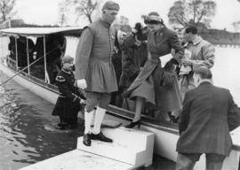 Princess Elizabeth disembarking from Enchantress, assisted by a Doggett&#039;s Coat and Badge winner